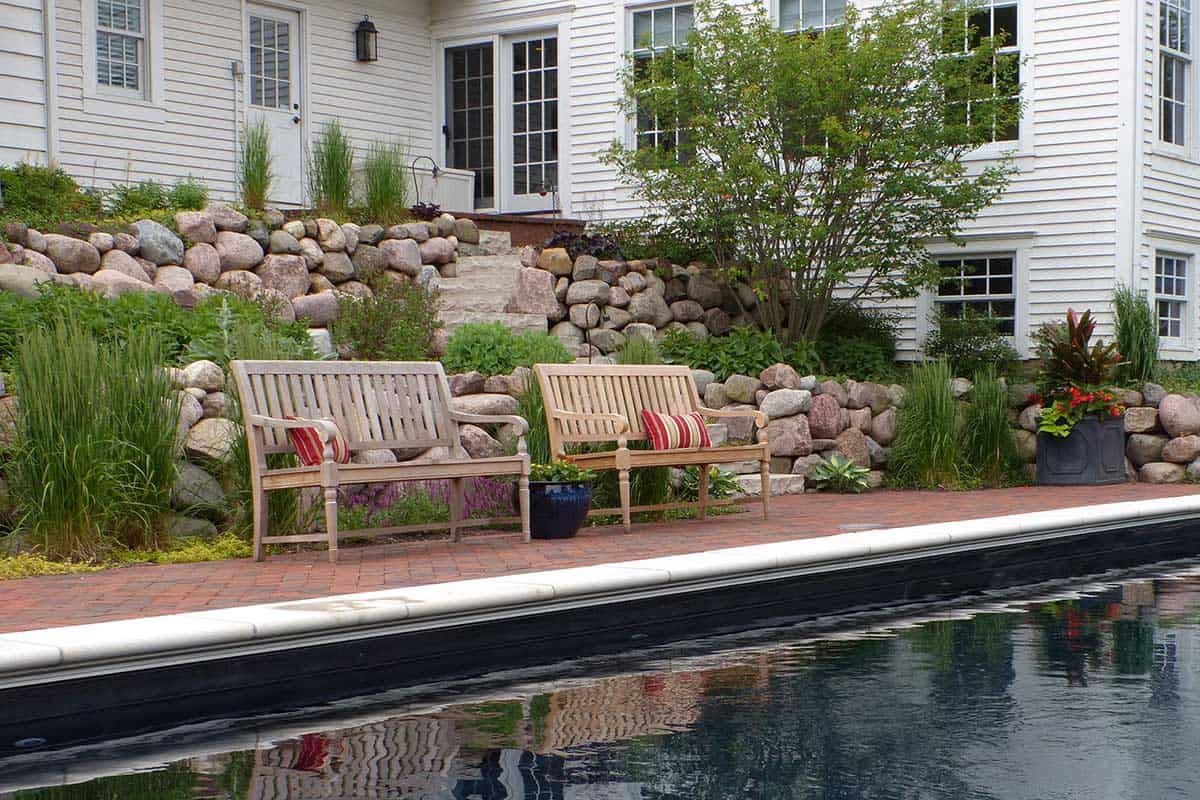 Black Bottom Pool with Boulder Retaining Wall