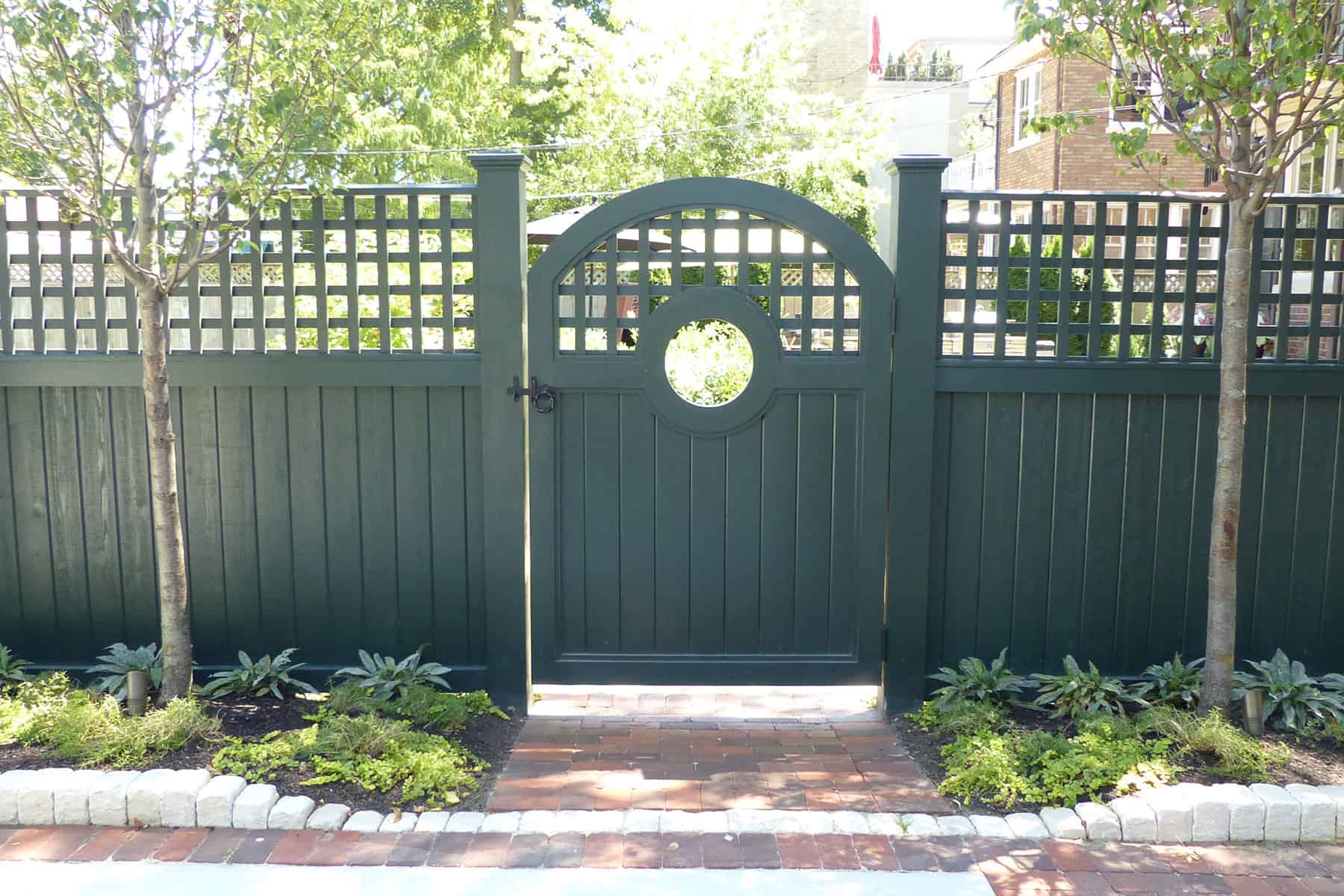green gate and fence with lattice top