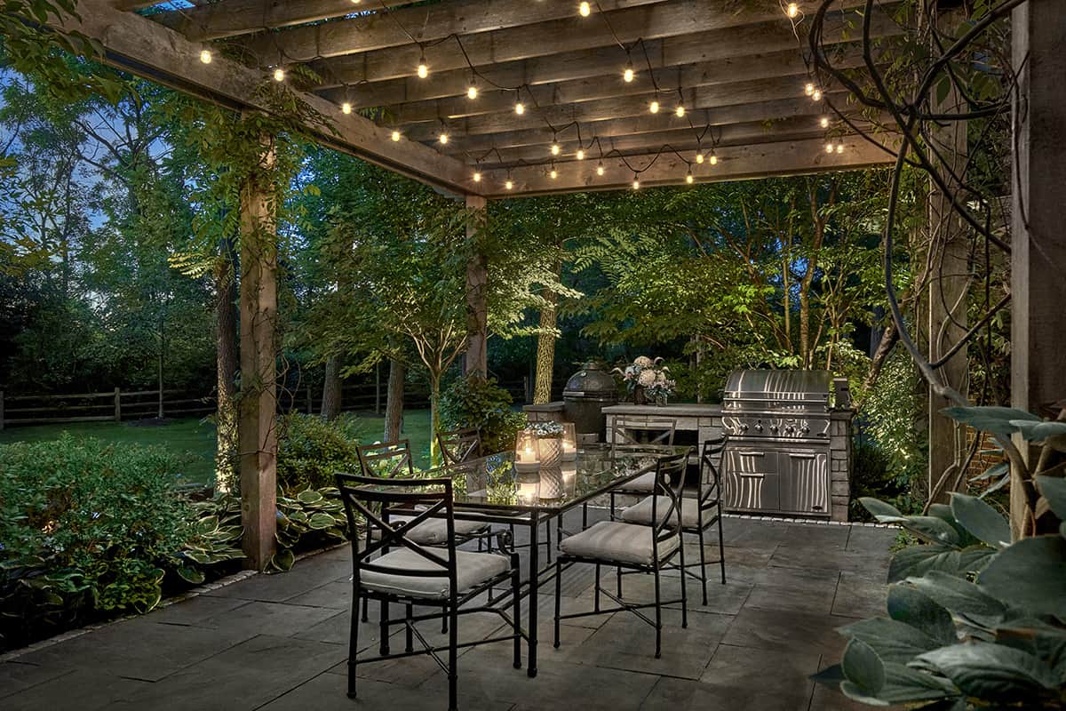 Outdoor Kitchen with Pergola at Night