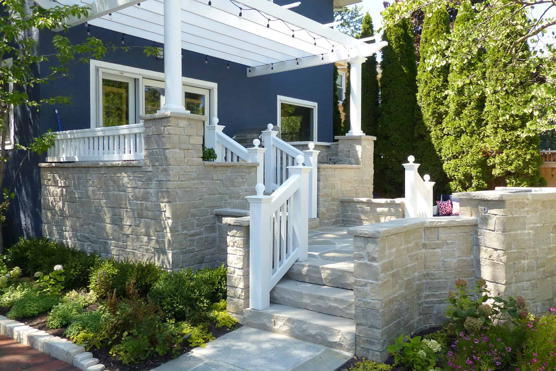 Raised Stone Terrace and Pergola Covered Entry