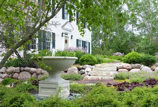 fountain on pedestal in garden