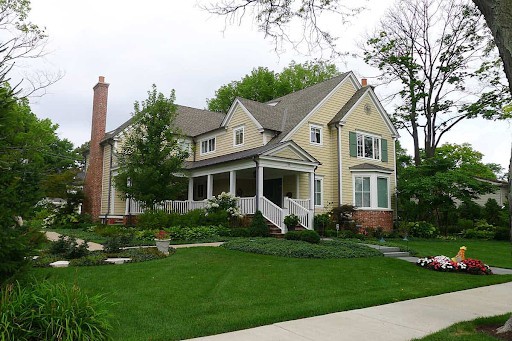 lush lawn in front of classic home
